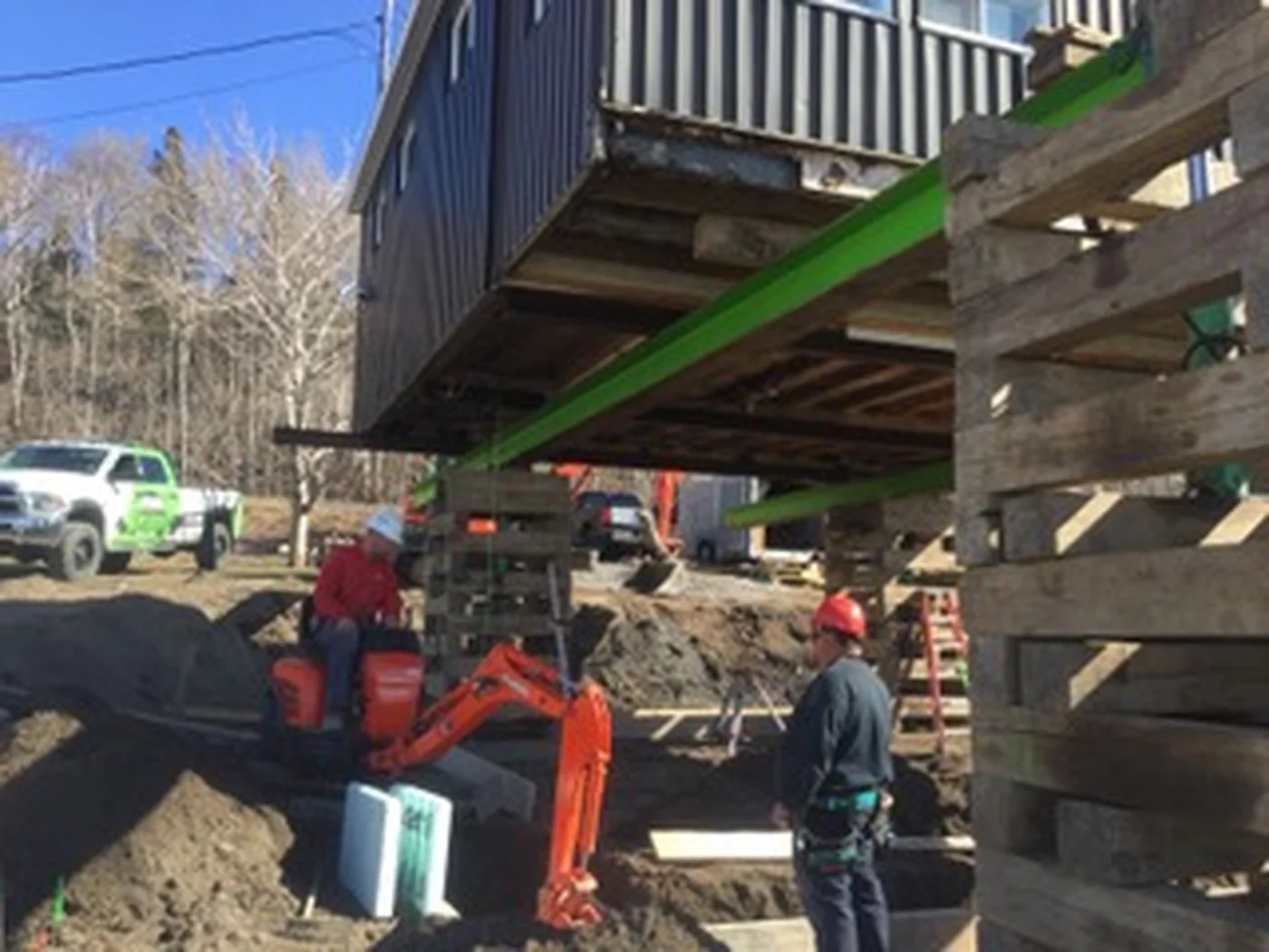 Building held on cribbing while the work goes on underneath