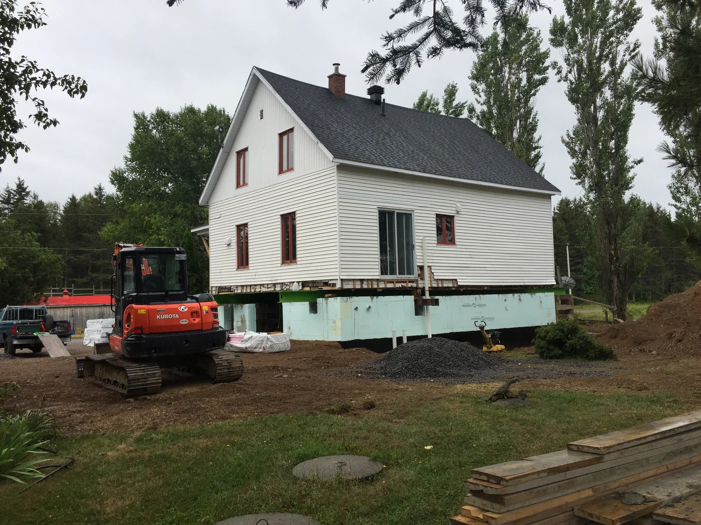 House lifted, excavation under way beneath the building