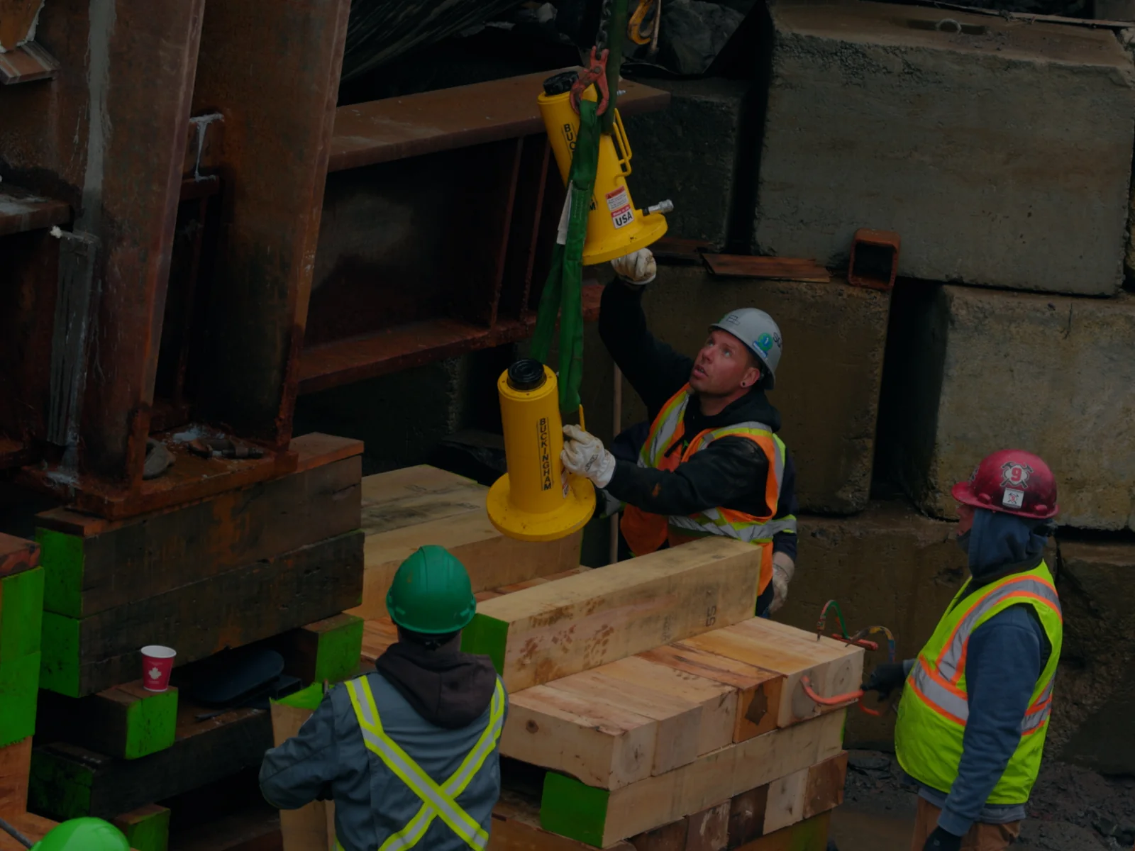 Hydraulic jacks set under the structure